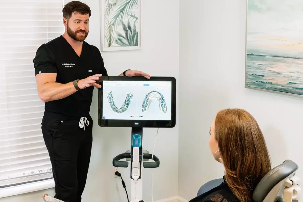 Dr. Clayton reviewing a digital scan with a patient